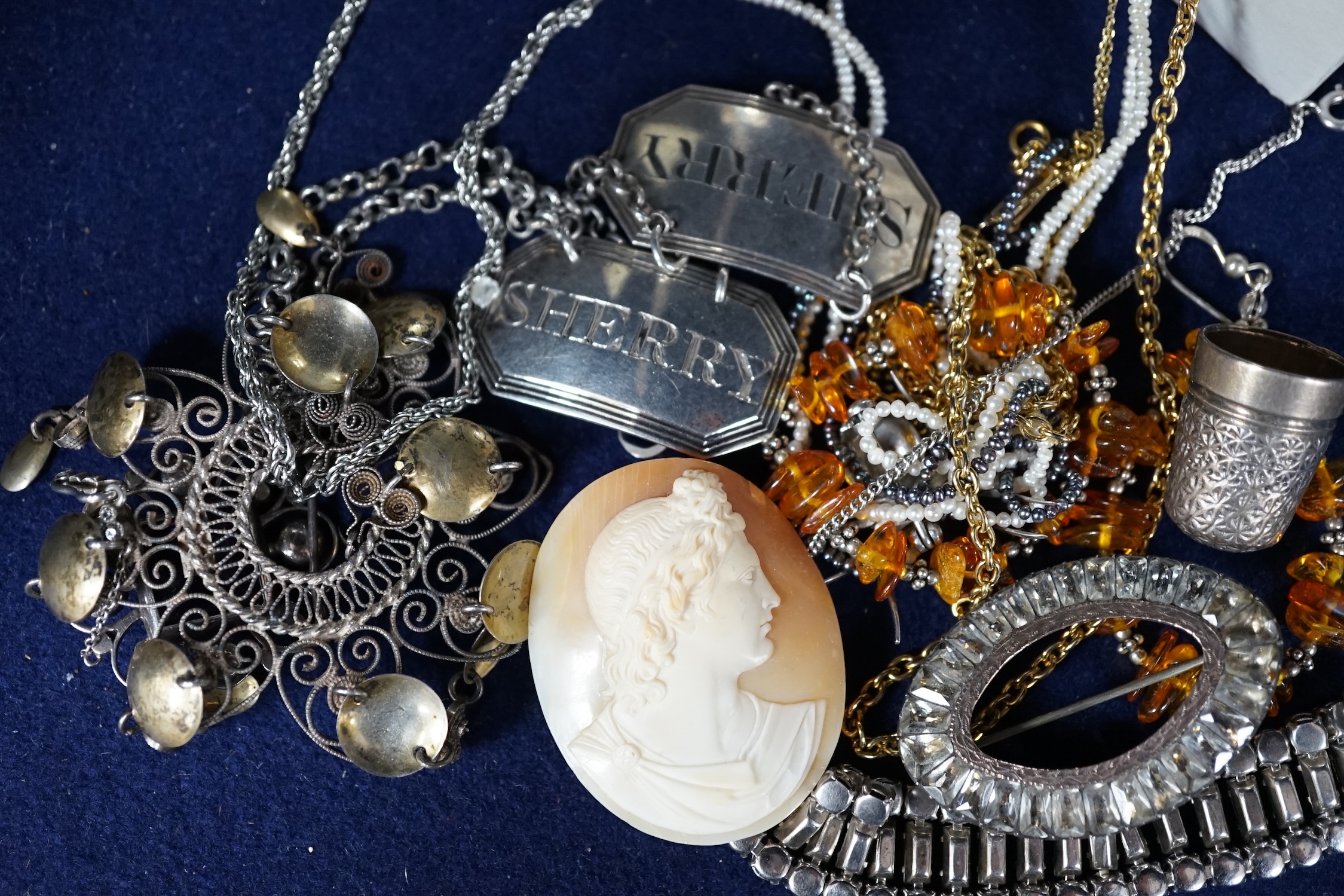 A small collection of assorted costume jewellery and other items including a paste set fringe necklace and brooch and two Georgian silver wine labels, London, 1818 and London 1828. Condition - poor to fair